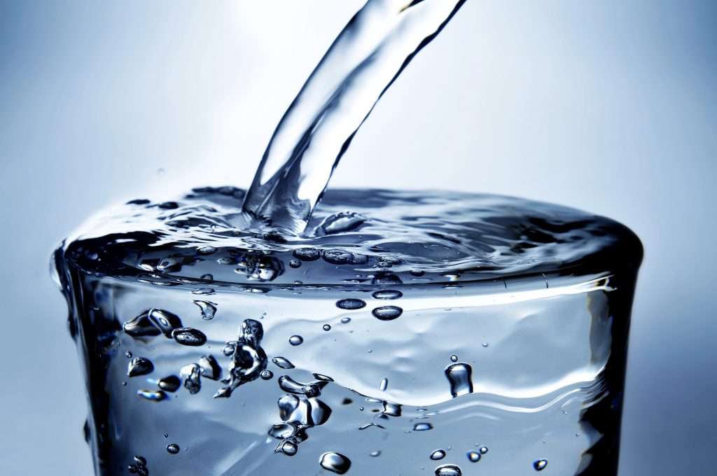 A close-up of a refreshing glass of well water.